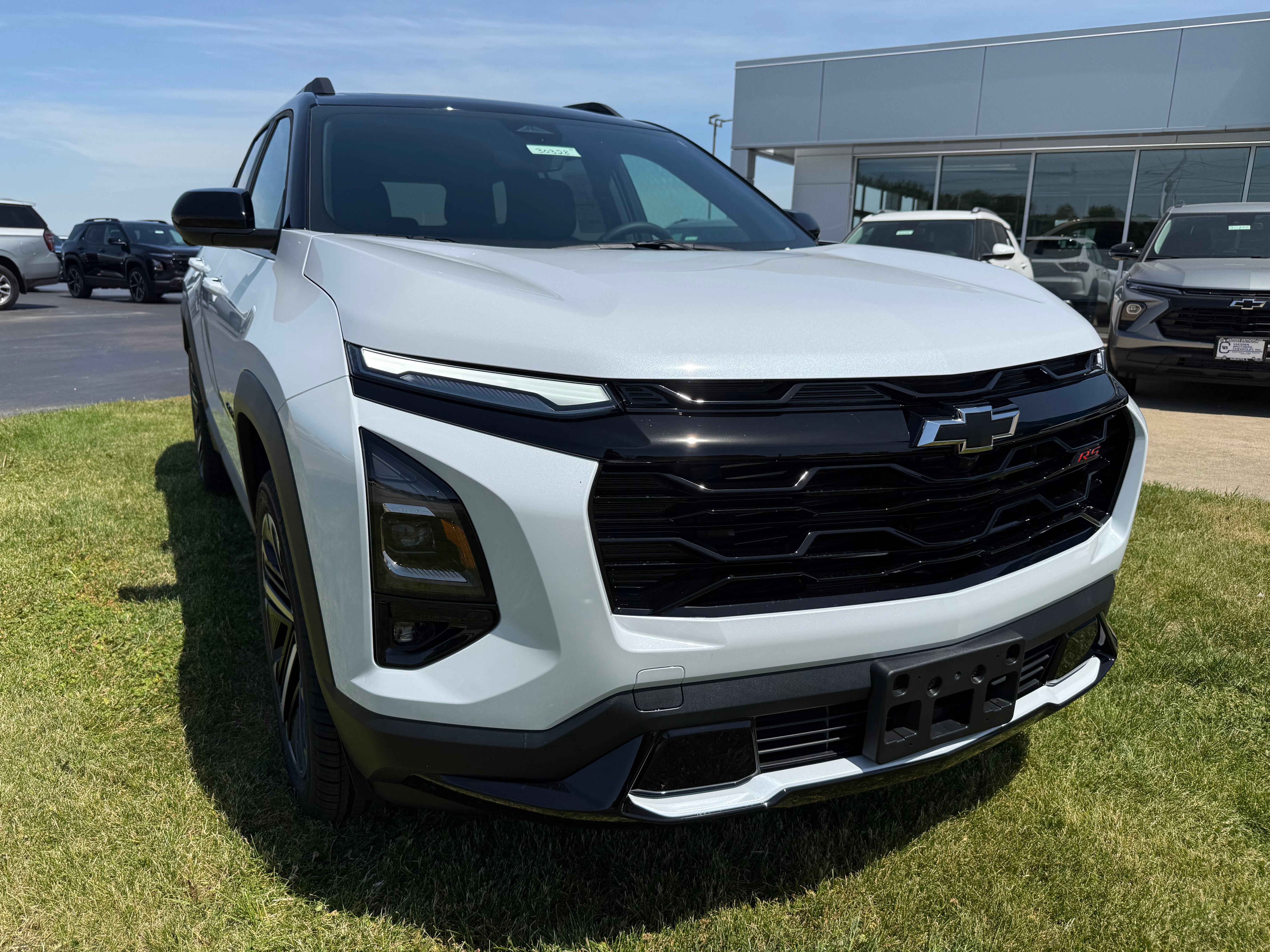 2026 Chevrolet Equinox RS in Polar White Tricoat — front three-quarter view